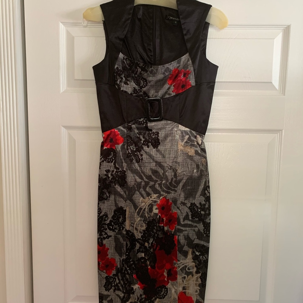 Sleek form fitting satin dress. High style.